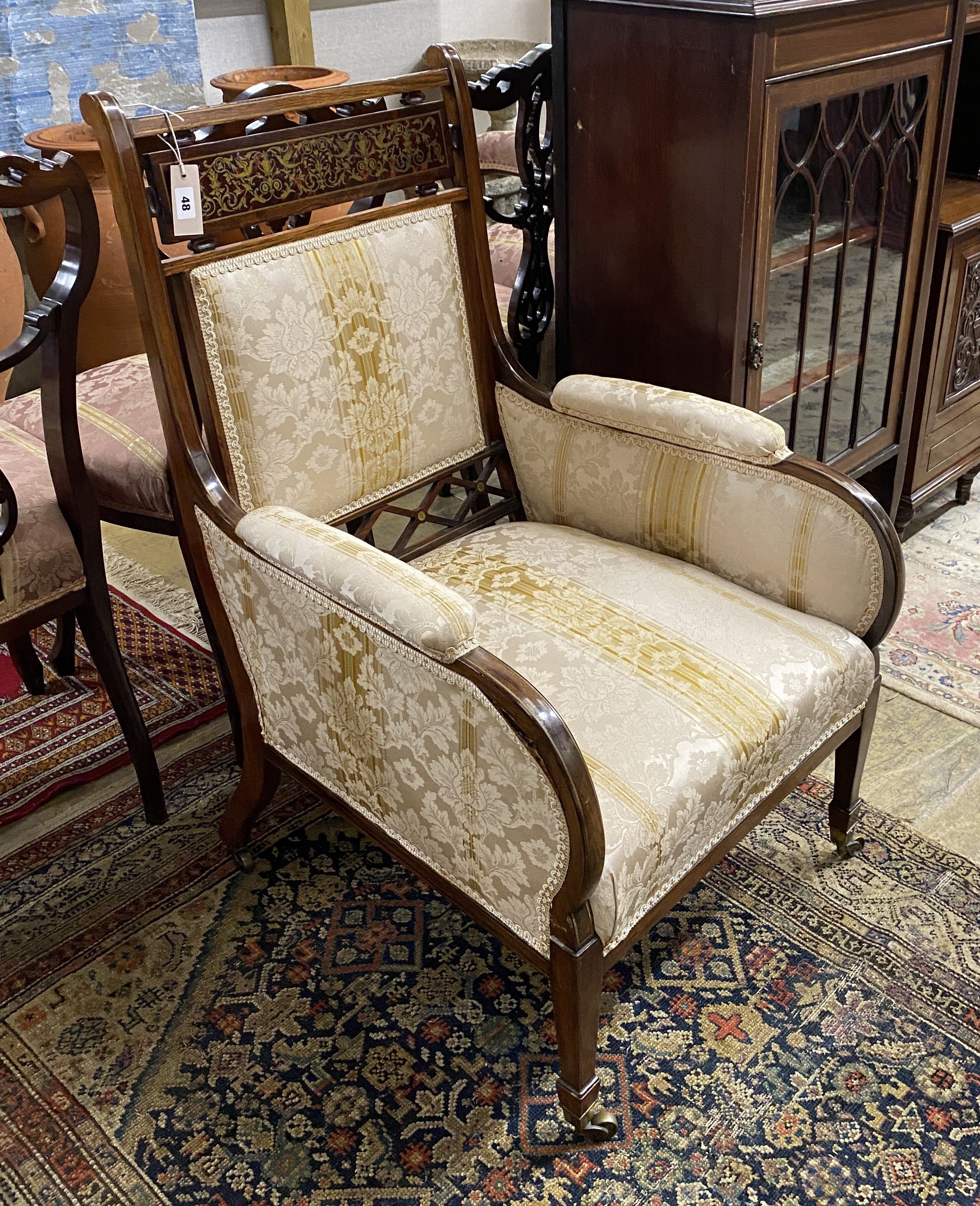 An Edwardian brass inlaid and boulle work rosewood upholstered armchair, width 60cm, depth 60cm, height 96cm